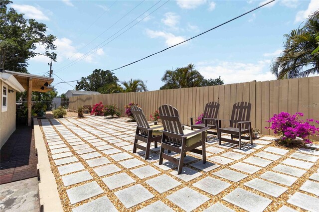1212 Princeton Ave, Bradenton, FL 34207 - fenced backyard featuring a patio area