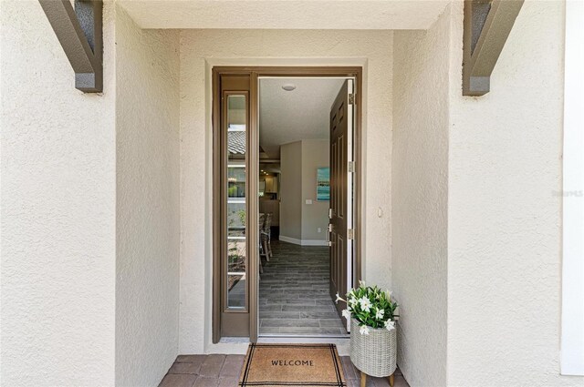 3027 Formia Ct, Lakewood Ranch, FL 34211 - doorway to property featuring stucco siding