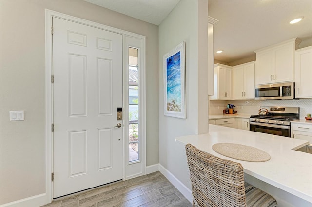 3027 Formia Ct, Lakewood Ranch, FL 34211 - foyer entrance featuring light wood finished floors and recessed lighting