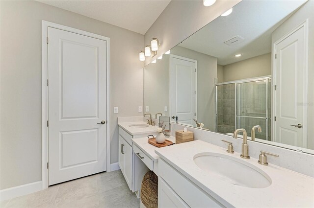 3027 Formia Ct, Lakewood Ranch, FL 34211 - bathroom with double vanity, a shower stall, and tile patterned floors
