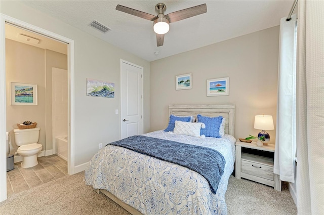 3027 Formia Ct, Lakewood Ranch, FL 34211 - carpeted bedroom with connected bathroom and ceiling fan