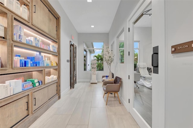 3027 Formia Ct, Lakewood Ranch, FL 34211 - hall with baseboards and light tile patterned flooring