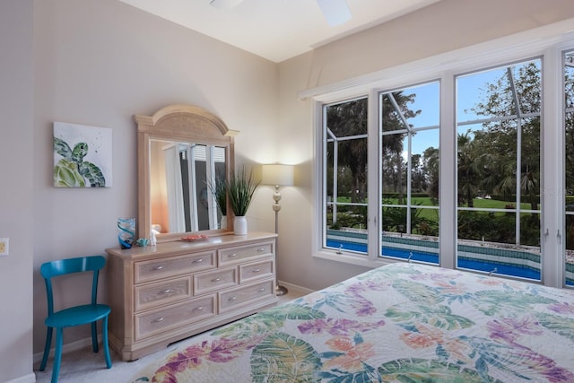 carpeted bedroom with baseboards and multiple windows