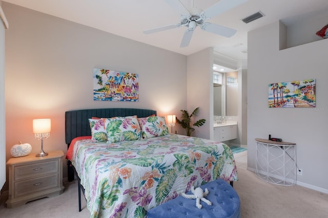 bedroom with light colored carpet, baseboards, connected bathroom, and ceiling fan