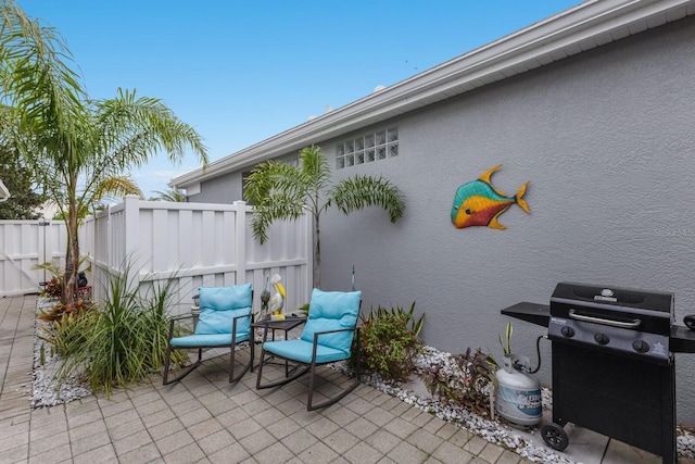 view of patio with fence and grilling area