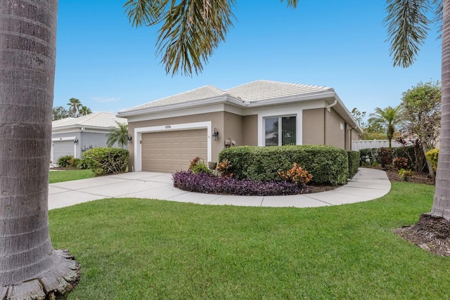 view of front of house featuring a garage, concrete driveway, stucco siding, and a front yard