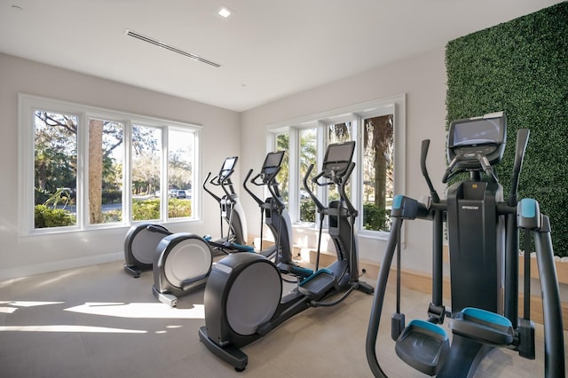 workout room with baseboards