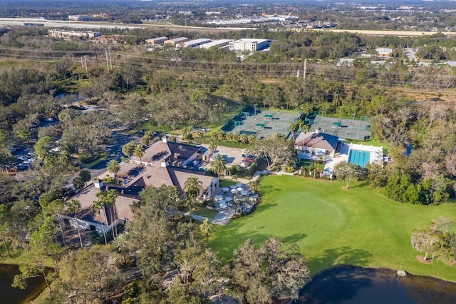 aerial view of property and surrounding area with a golf course
