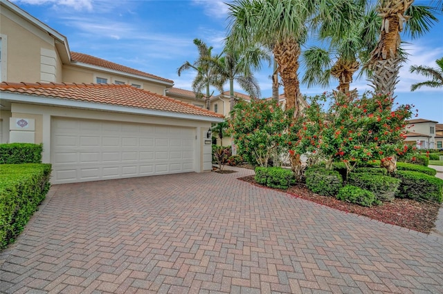 23233 Banbury Way Unit 302, Venice, FL 34293 - garage with decorative driveway
