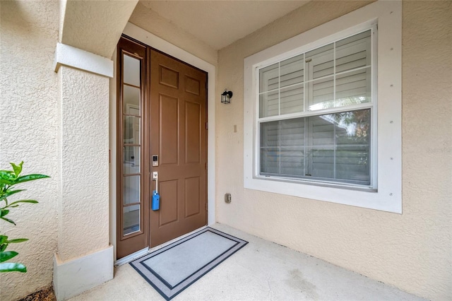23233 Banbury Way Unit 302, Venice, FL 34293 - property entrance with stucco siding
