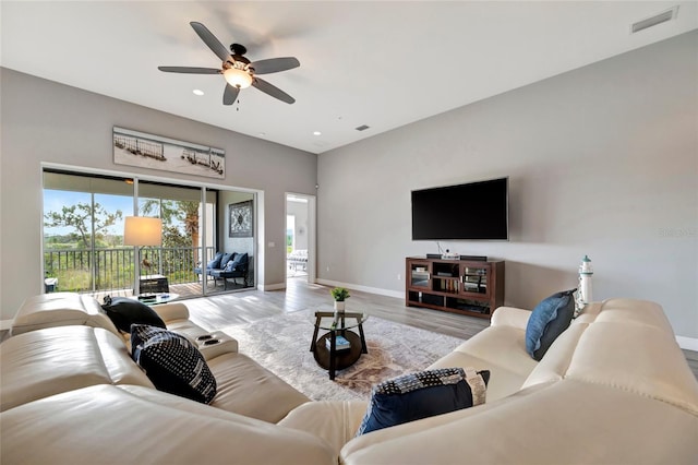 23233 Banbury Way Unit 302, Venice, FL 34293 - living room featuring baseboards, wood finished floors, ceiling fan, and recessed lighting