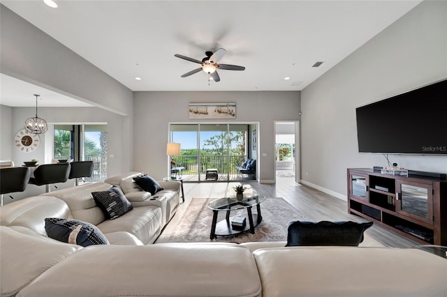 23233 Banbury Way Unit 302, Venice, FL 34293 - living room with plenty of natural light, ceiling fan, wood finished floors, baseboards, and recessed lighting