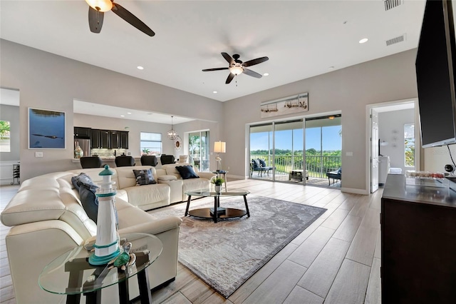 23233 Banbury Way Unit 302, Venice, FL 34293 - living area with a ceiling fan, healthy amount of natural light, recessed lighting, and light wood finished floors