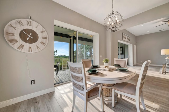 23233 Banbury Way Unit 302, Venice, FL 34293 - dining area with light wood-style flooring, a chandelier, baseboards, and ceiling fan