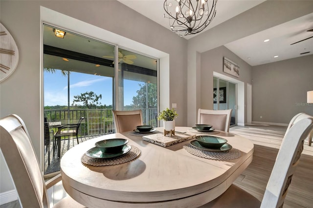 23233 Banbury Way Unit 302, Venice, FL 34293 - dining space with wood finished floors, baseboards, and a chandelier
