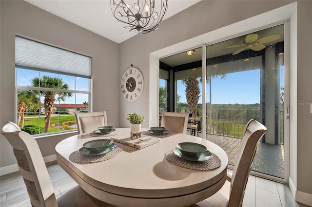 23233 Banbury Way Unit 302, Venice, FL 34293 - dining room featuring baseboards and a chandelier