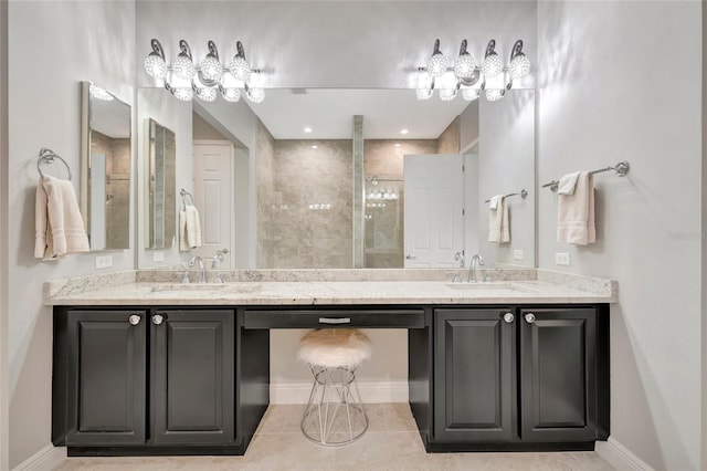 23233 Banbury Way Unit 302, Venice, FL 34293 - full bath with double vanity, a stall shower, baseboards, and tile patterned floors