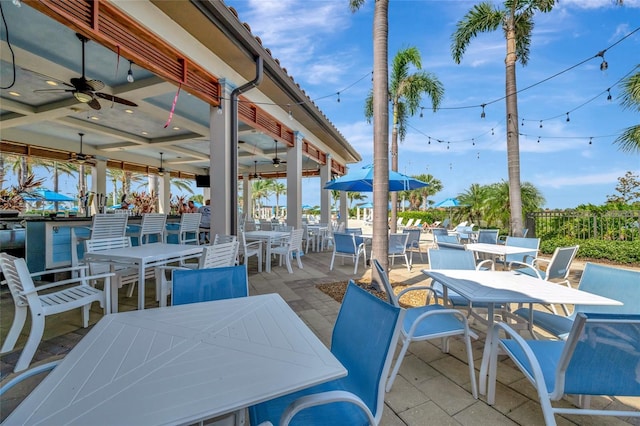 23233 Banbury Way Unit 302, Venice, FL 34293 - view of patio featuring outdoor dining area and ceiling fan