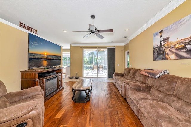 230 Fareham Dr, Venice, FL 34293 - living room with hardwood / wood-style flooring, ceiling fan, a glass covered fireplace, ornamental molding, and recessed lighting