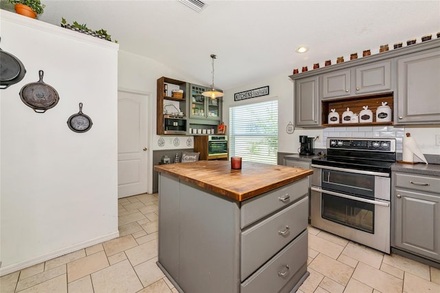 230 Fareham Dr, Venice, FL 34293 - kitchen with gray cabinetry, double oven range, open shelves, wooden counters, and lofted ceiling