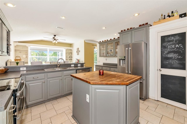 230 Fareham Dr, Venice, FL 34293 - kitchen with appliances with stainless steel finishes, butcher block countertops, gray cabinetry, a kitchen island, and recessed lighting