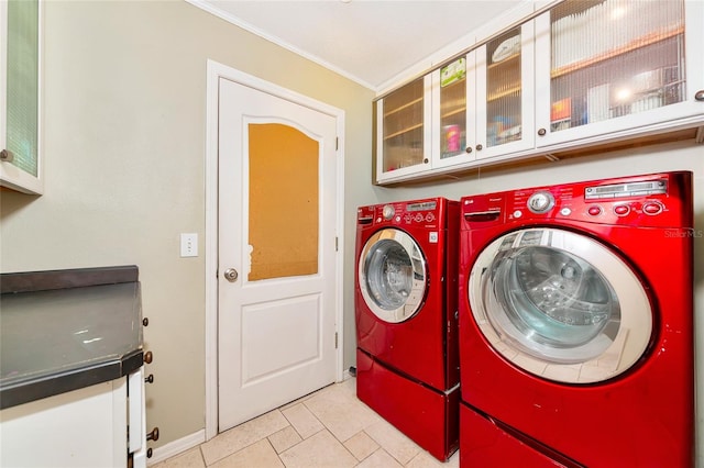 230 Fareham Dr, Venice, FL 34293 - laundry area with cabinet space, independent washer and dryer, ornamental molding, light tile patterned floors, and baseboards