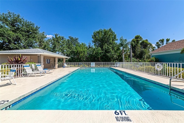 230 Fareham Dr, Venice, FL 34293 - community pool with a patio and view of wooded area