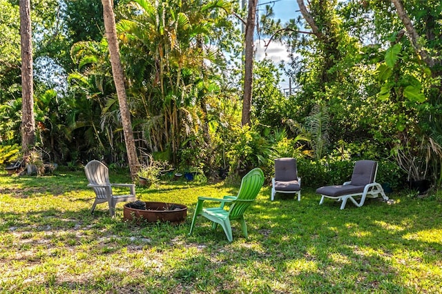 230 Fareham Dr, Venice, FL 34293 - view of grassy yard featuring a fire pit