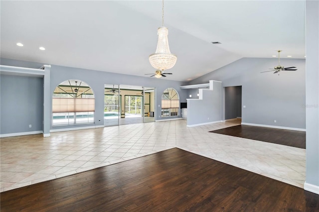 296 Pine Ranch Trl, Osprey, FL 34229 - unfurnished living room featuring a ceiling fan, wood finished floors, a chandelier, vaulted ceiling, and recessed lighting