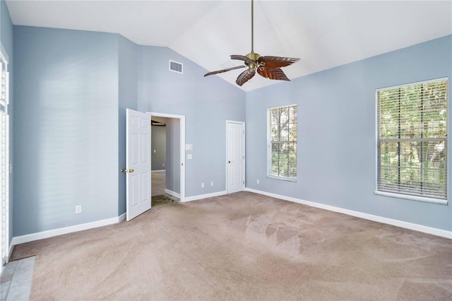 296 Pine Ranch Trl, Osprey, FL 34229 - unfurnished bedroom with carpet flooring, baseboards, and high vaulted ceiling