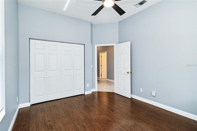 296 Pine Ranch Trl, Osprey, FL 34229 - unfurnished bedroom with baseboards, wood finished floors, a closet, and ceiling fan