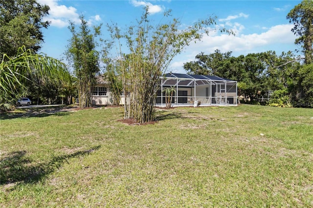 296 Pine Ranch Trl, Osprey, FL 34229 - view of green lawn featuring glass enclosure