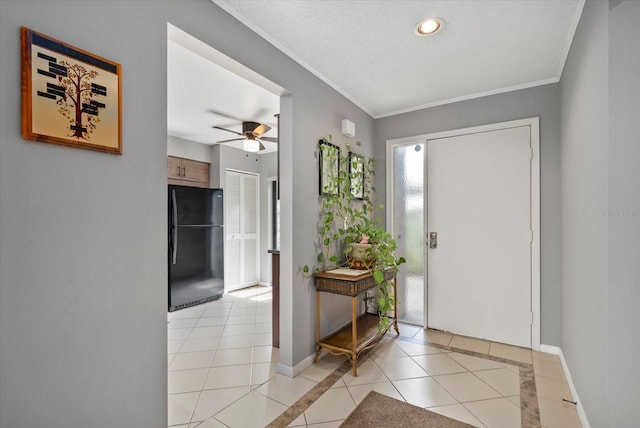 4505 Kingsmere Unit 2, Sarasota, FL 34235 - entryway with light tile patterned floors, ceiling fan, ornamental molding, recessed lighting, and baseboards
