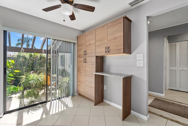 4505 Kingsmere Unit 2, Sarasota, FL 34235 - unfurnished dining area with light tile patterned floors, a ceiling fan, and baseboards