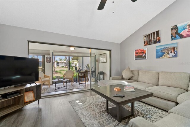 4505 Kingsmere Unit 2, Sarasota, FL 34235 - living area featuring ceiling fan, vaulted ceiling, and wood finished floors