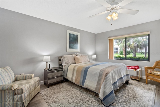 4505 Kingsmere Unit 2, Sarasota, FL 34235 - bedroom with baseboards, wood finished floors, and ceiling fan