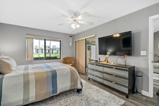 4505 Kingsmere Unit 2, Sarasota, FL 34235 - bedroom featuring wood finished floors, a closet, and ceiling fan