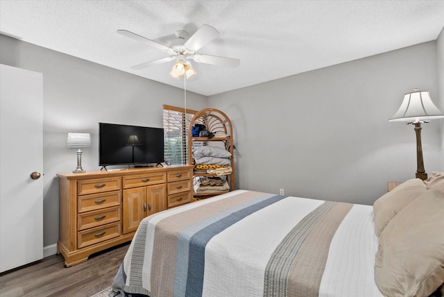 4505 Kingsmere Unit 2, Sarasota, FL 34235 - bedroom featuring wood finished floors, baseboards, a ceiling fan, and a textured ceiling
