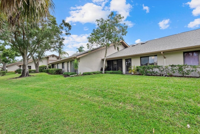 4505 Kingsmere Unit 2, Sarasota, FL 34235 - view of front of property featuring stucco siding and a front lawn