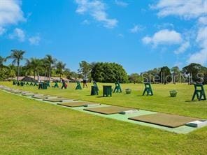 4505 Kingsmere Unit 2, Sarasota, FL 34235 - surrounding community with a game area and a yard