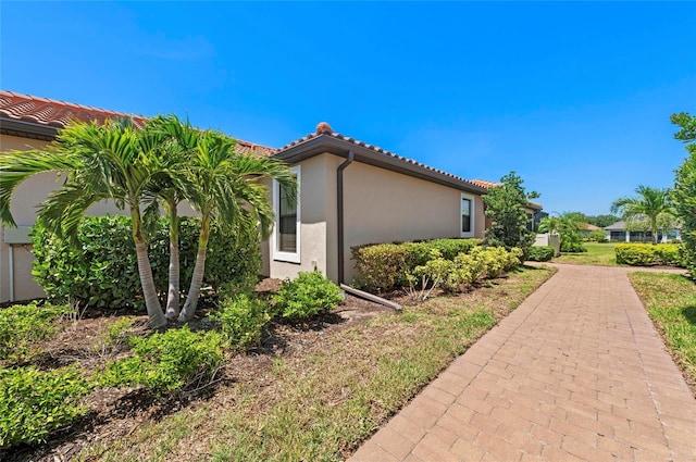 15707 Sacile Ln, Bradenton, FL 34211 - view of home's exterior with stucco siding and a tiled roof