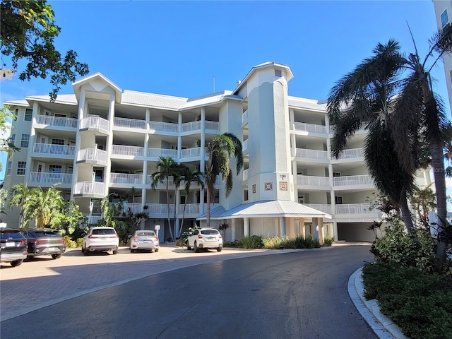 1280 Dolphin Bay Way Unit 204, Sarasota, FL 34242 - view of apartment building / complex featuring uncovered parking