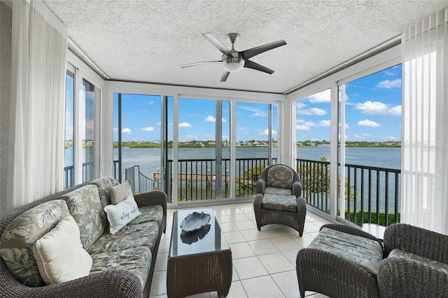 1280 Dolphin Bay Way Unit 204, Sarasota, FL 34242 - sunroom with a water view, tile patterned floors, and a textured ceiling