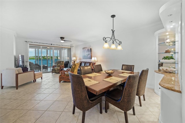 1280 Dolphin Bay Way Unit 204, Sarasota, FL 34242 - dining room with crown molding and light tile patterned flooring
