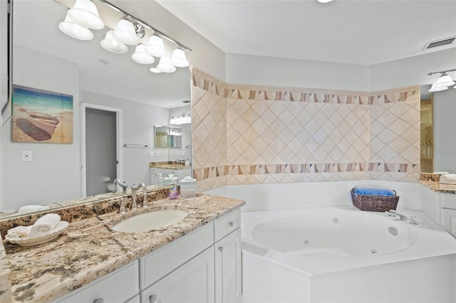 1280 Dolphin Bay Way Unit 204, Sarasota, FL 34242 - full bathroom featuring a jetted tub and vanity
