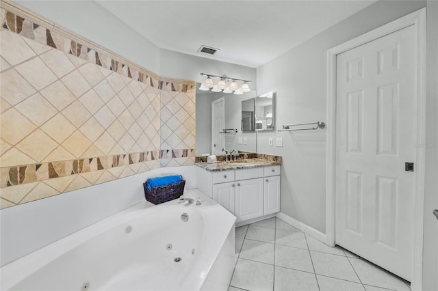 1280 Dolphin Bay Way Unit 204, Sarasota, FL 34242 - bathroom with a whirlpool tub, tile patterned floors, vanity, and baseboards
