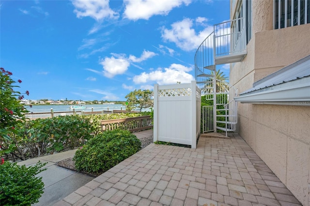 1280 Dolphin Bay Way Unit 204, Sarasota, FL 34242 - view of patio / terrace with a water view