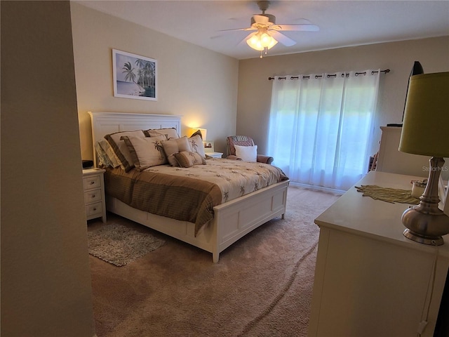 7273 Cedar Hollow Cir Unit 102, Bradenton, FL 34203 - bedroom with light carpet and ceiling fan