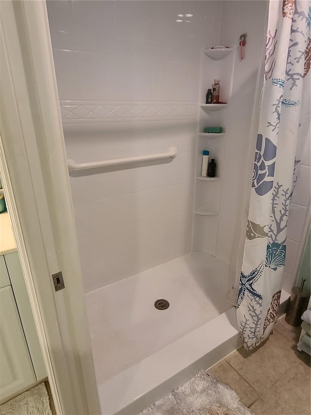 7273 Cedar Hollow Cir Unit 102, Bradenton, FL 34203 - bathroom with a stall shower and tile patterned flooring
