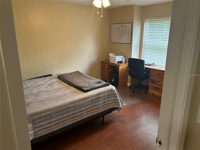 3287 Rackley Rd, Brooksville, FL 34604 - bedroom with wood finished floors and a desk